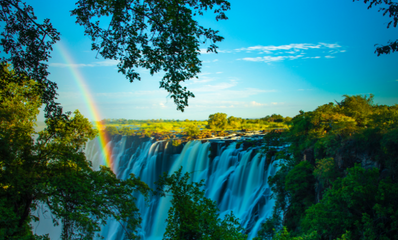 Vibrant rainbow over the stunning Victoria Falls in Zambia